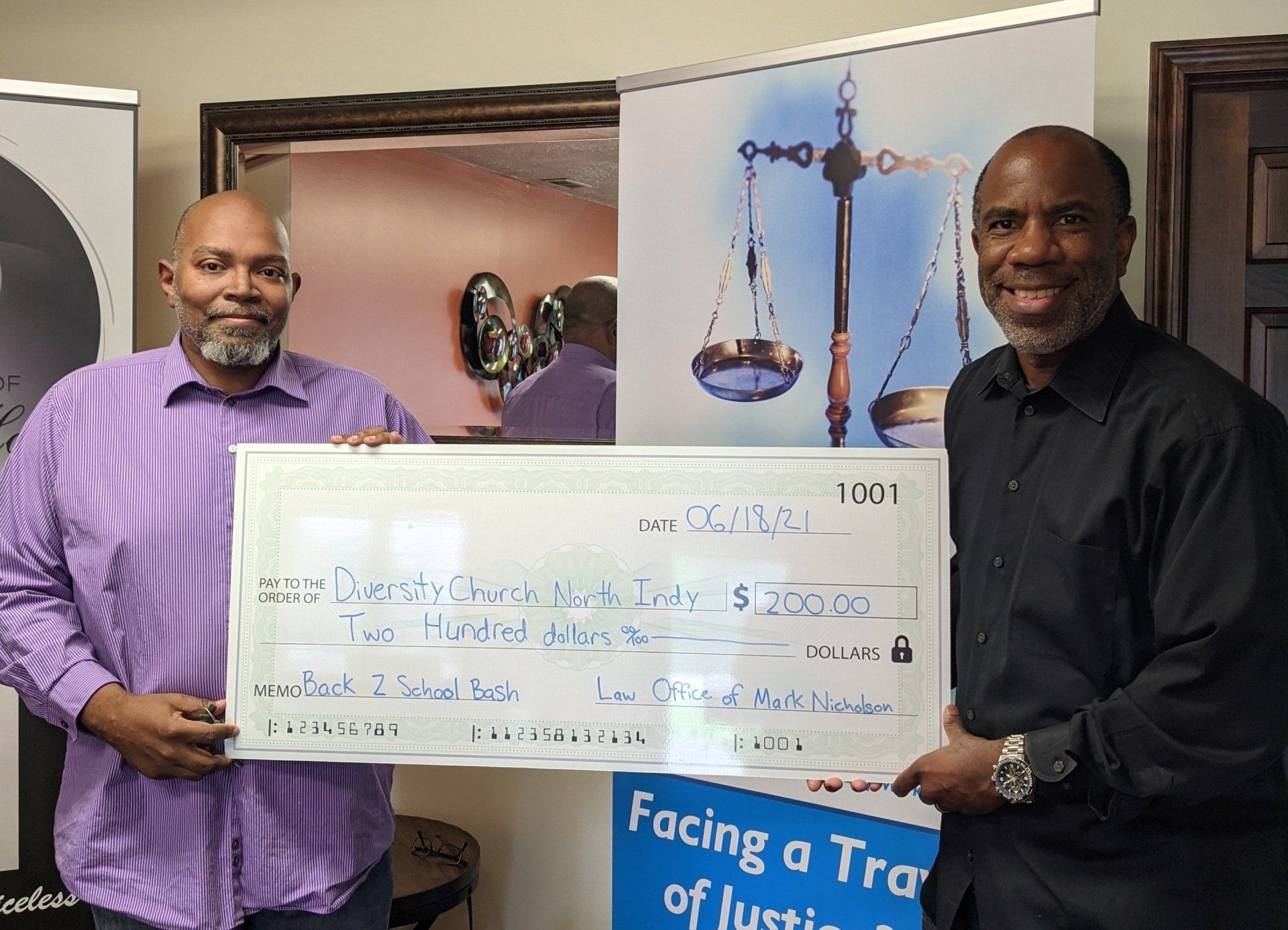 Diversity Church receives a check from Attorney Nicholson