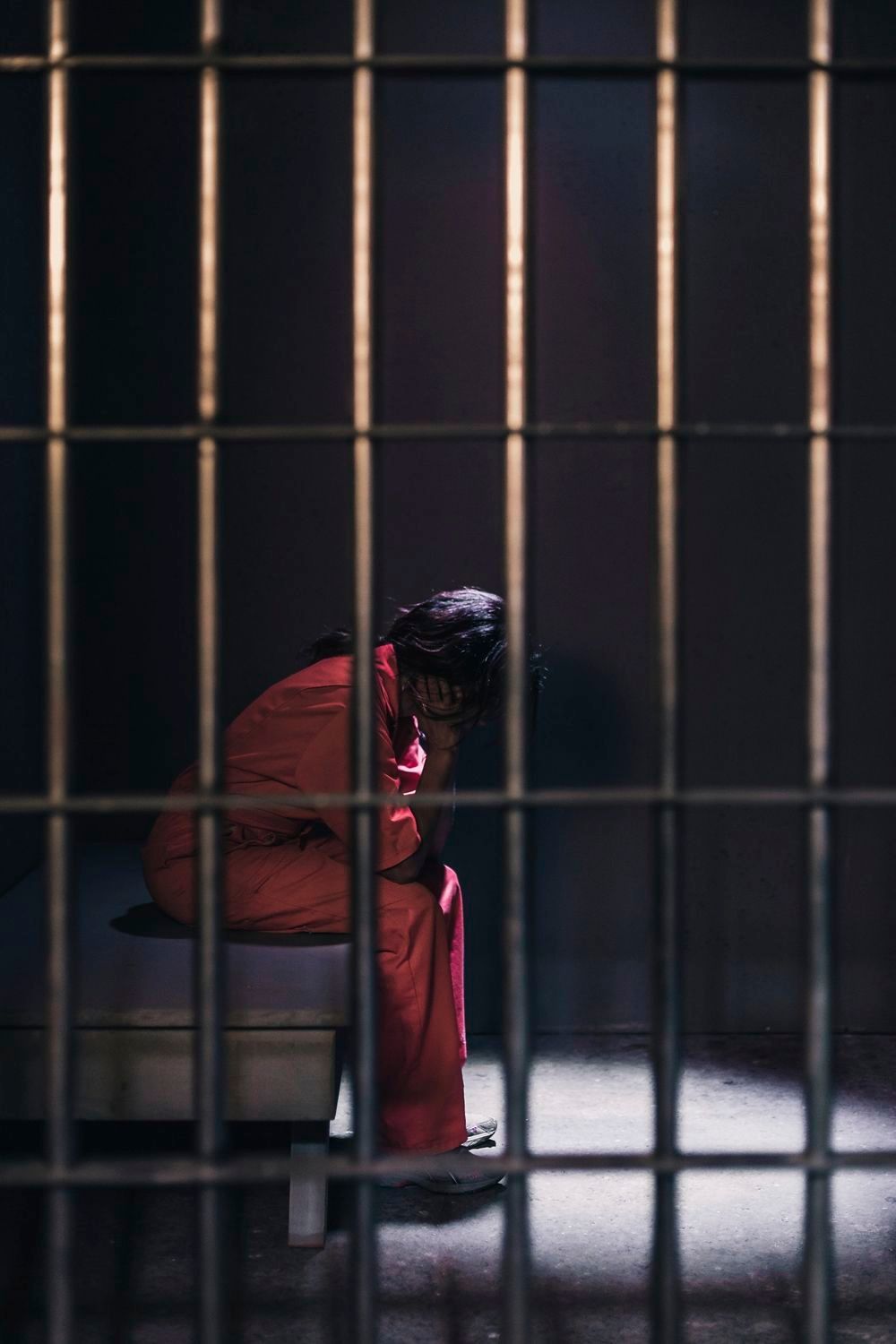 Woman in prison cell