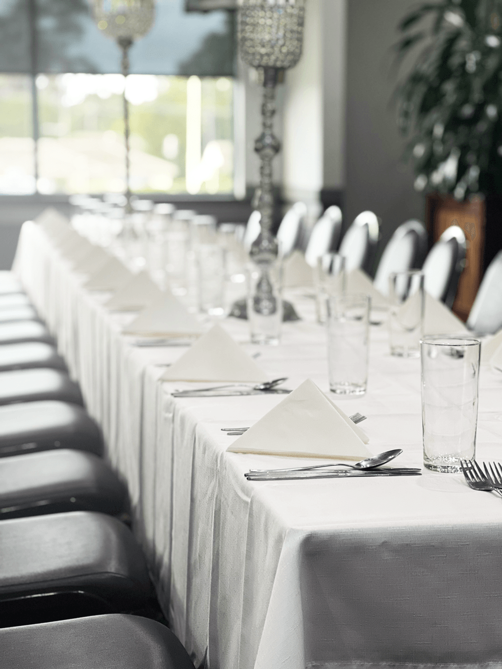 a long table all prepped up for an event