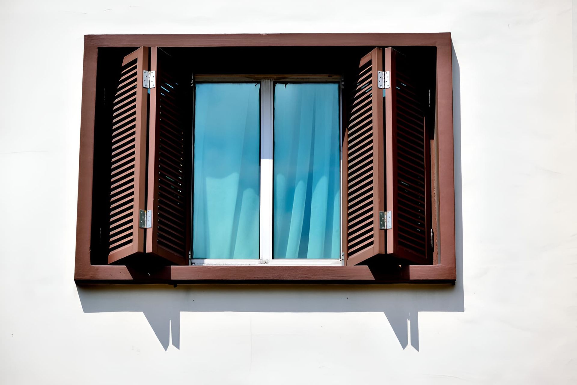 A Window With Shutters Open On A White Wall — All Hours Glass In Greenwell, NSW