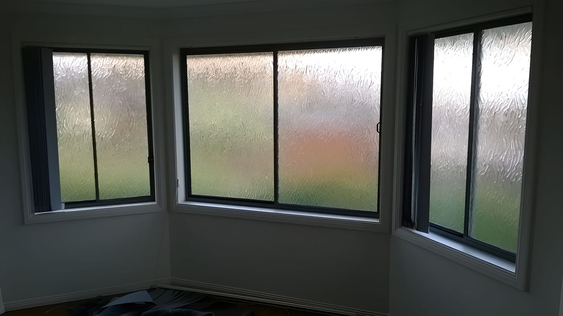 A Room With Three Windows And A Rug On The Floor — All Hours Glass In Culburra Beach, NSW
