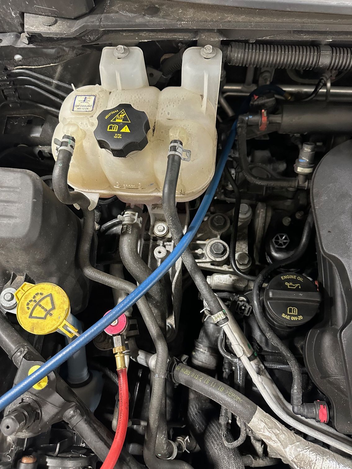 Auto AC Recharge Machine Hoses Attached to Vehicle | Lou's Car Care Center, Inc.