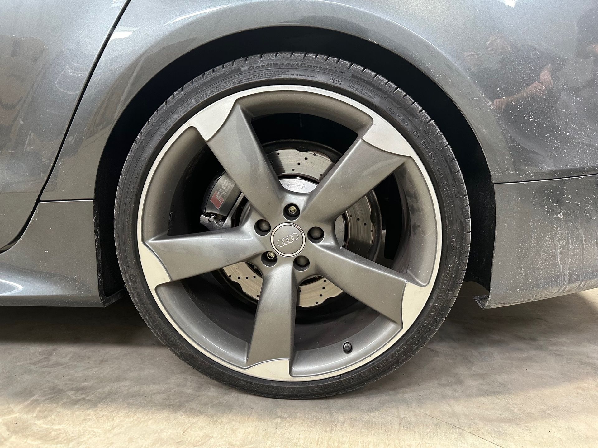 A close up of a car wheel with a brake disc | Lou's Car Care Center