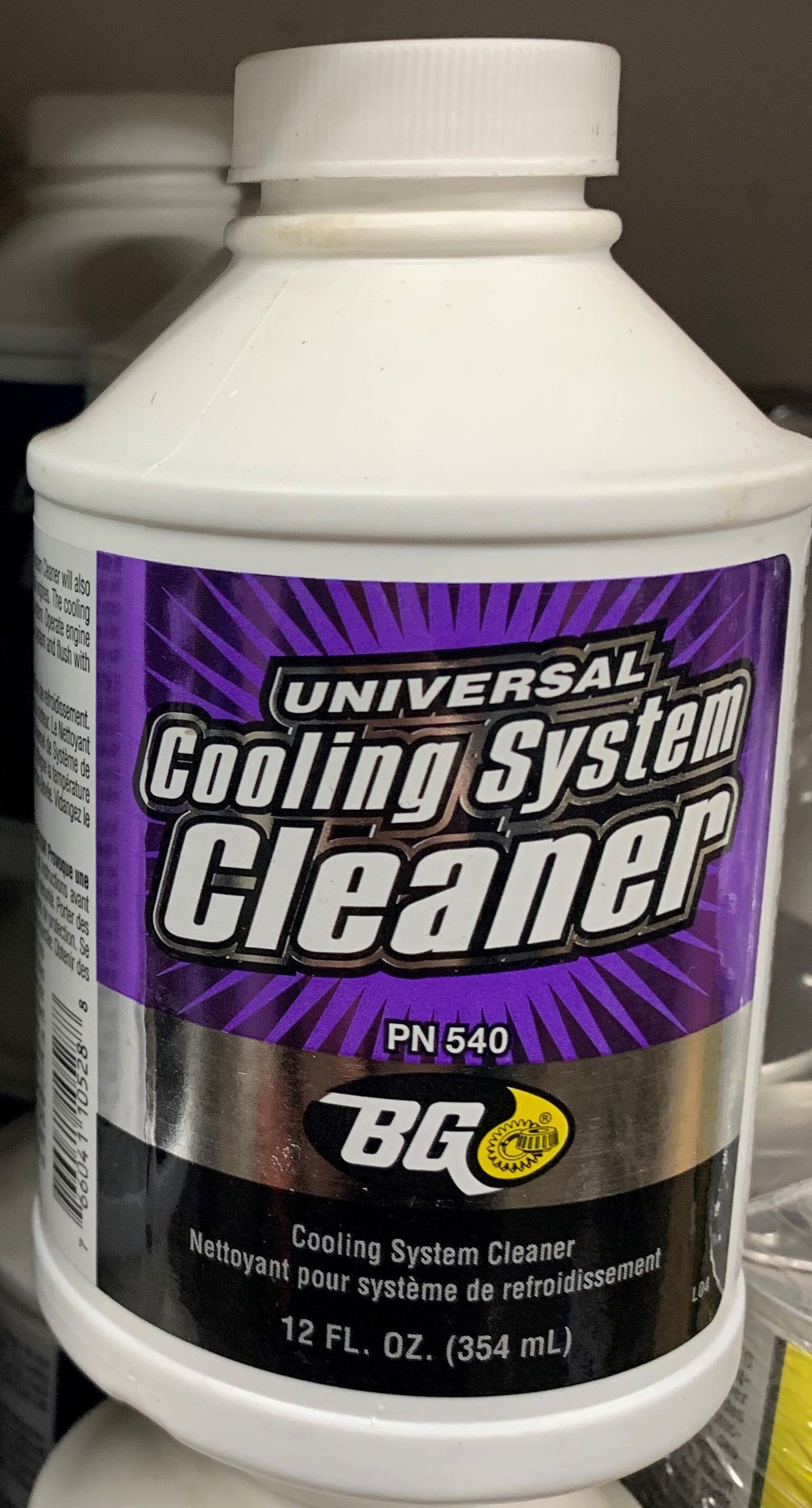 A bottle of universal cooling system cleaner is sitting on a shelf.  | Lou's Car Care Center, Inc.