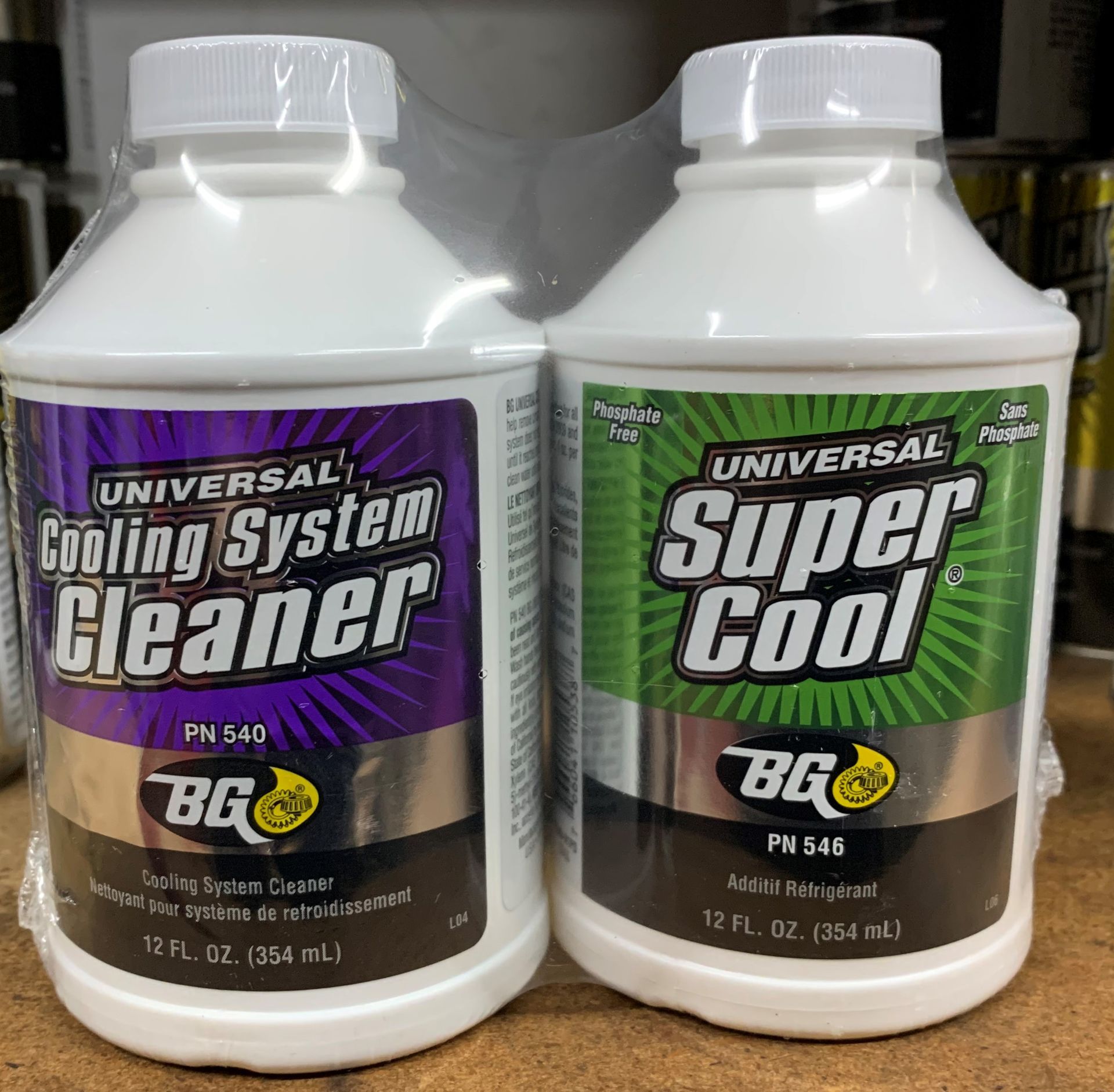 Two bottles of universal cooling system cleaner and super cool | Lou's Car Care Center, Inc.