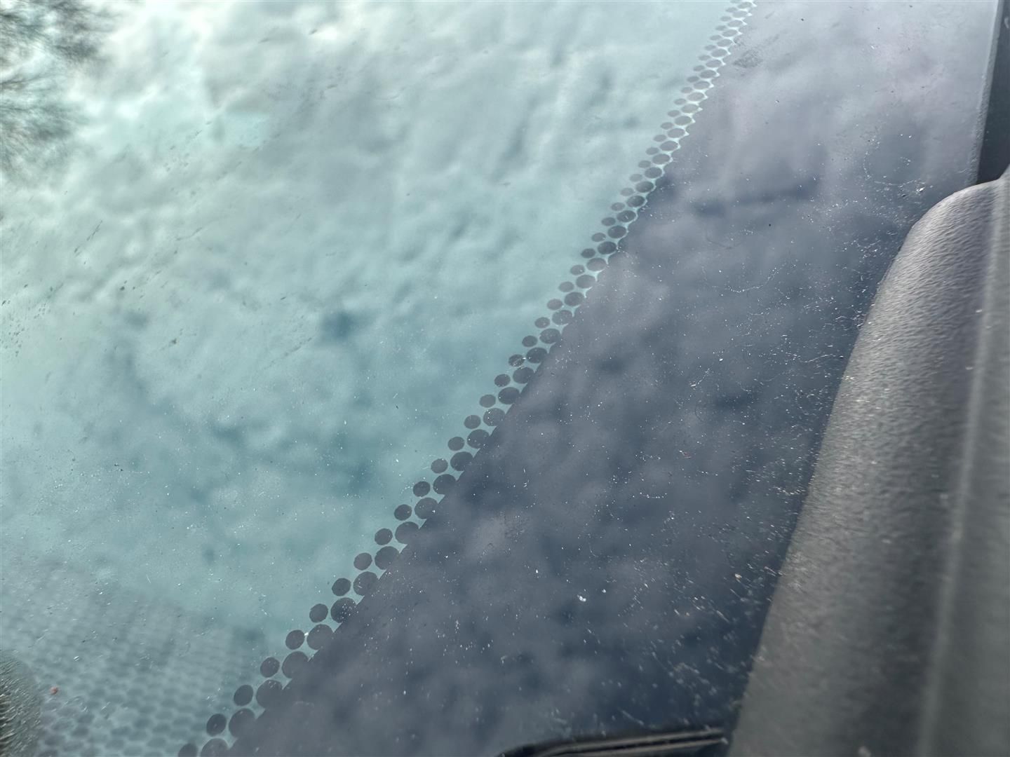 A close up of a car windshield with snow on it. | Lou's Car Care Center, Inc.