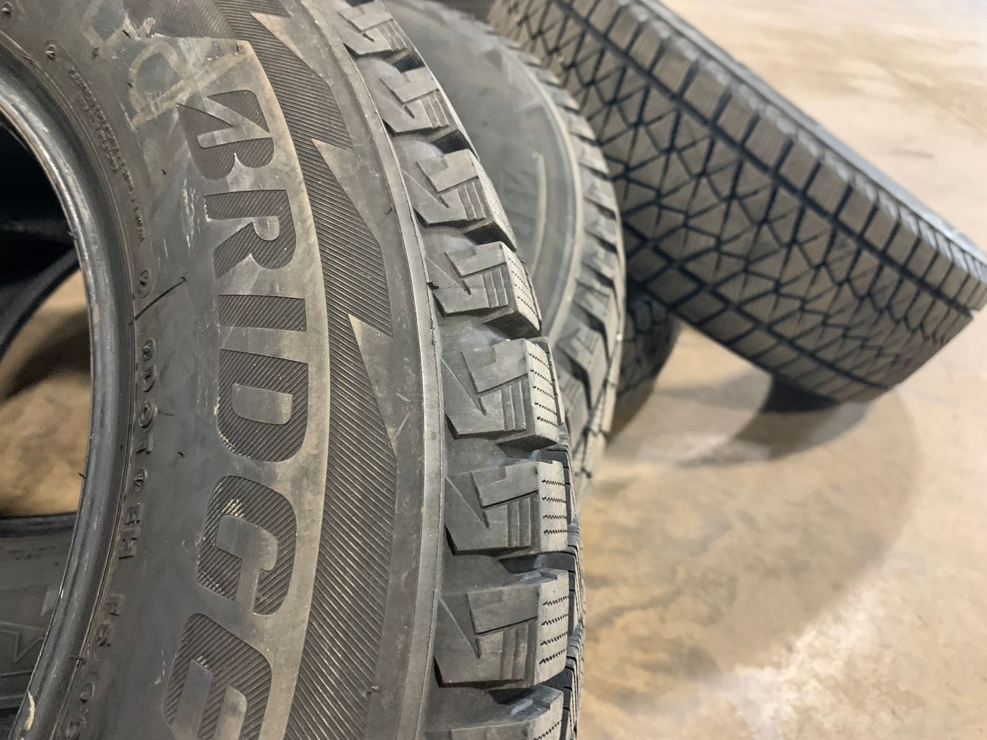 A pair of hankook tires are stacked on top of each other | Lou's Car Care Center Inc.