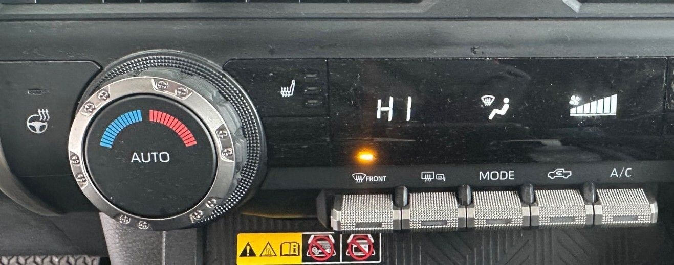 A close up of a car 's air conditioning control panel. | Lou's Car Care Center, Inc.