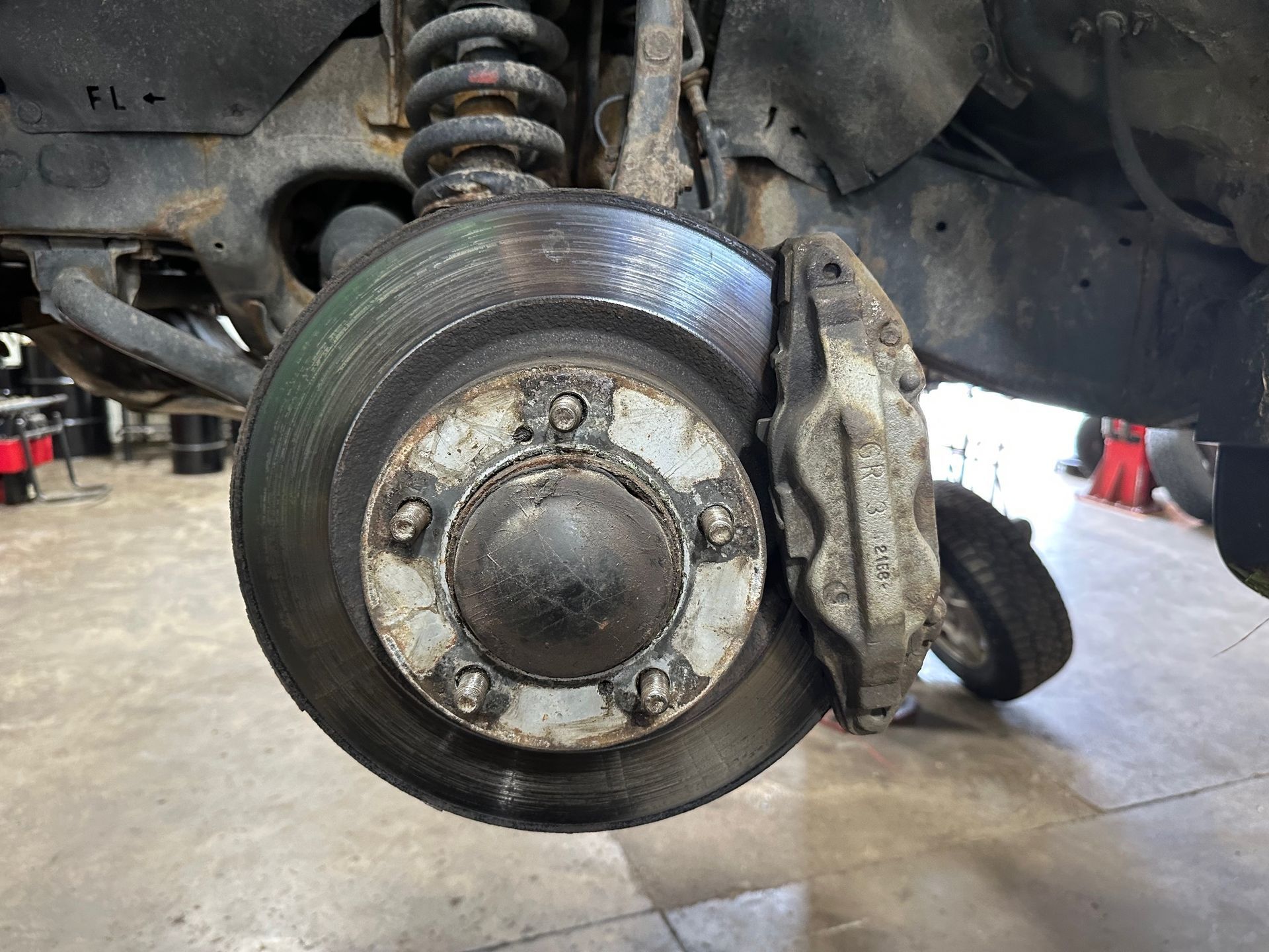 Brake pedal pulsating due to worn brake rotors causing uneven braking.
