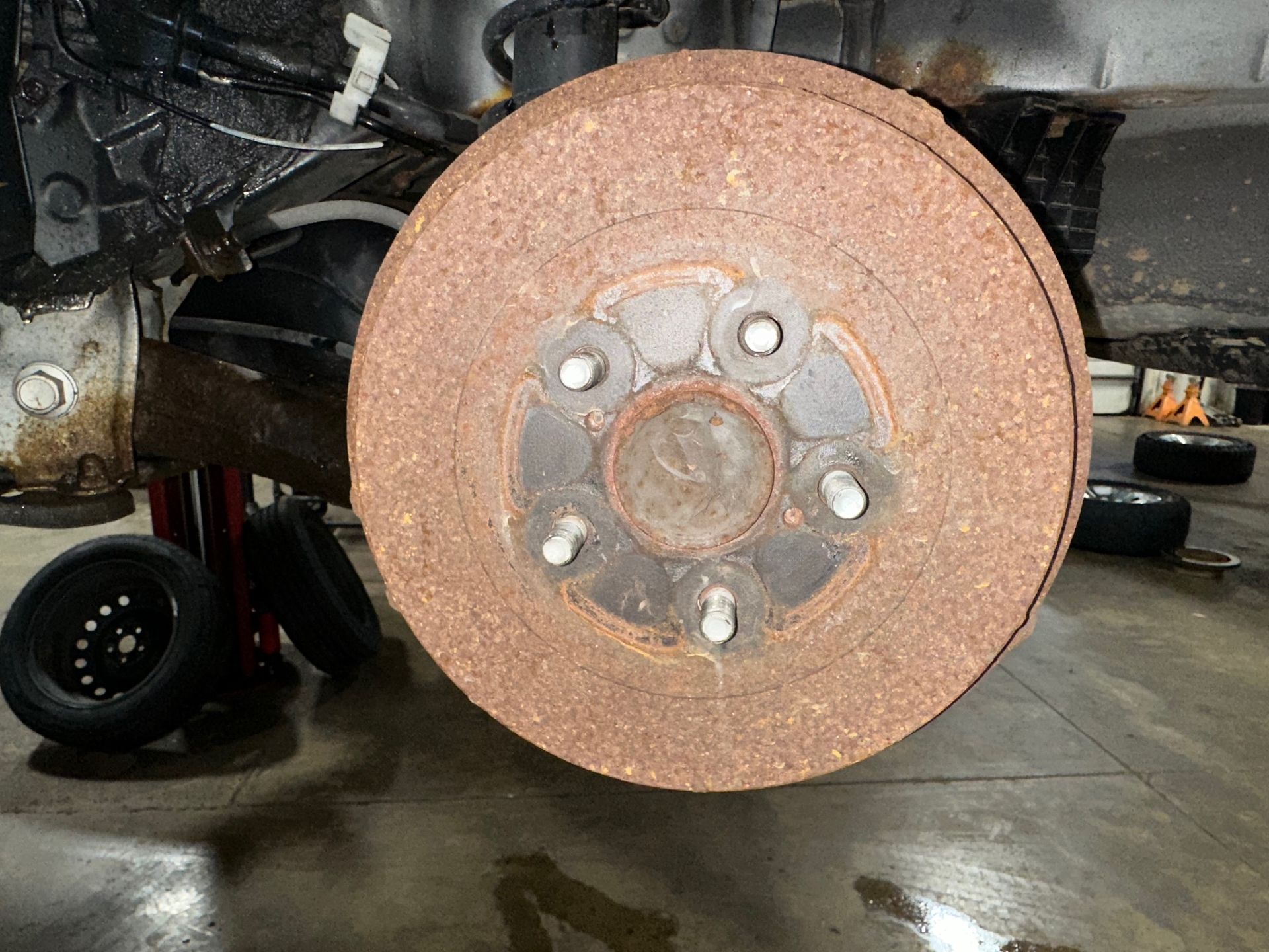Rusty Rear Drum Brakes on vehicle in shop | Lou's Car Care Center, inc.