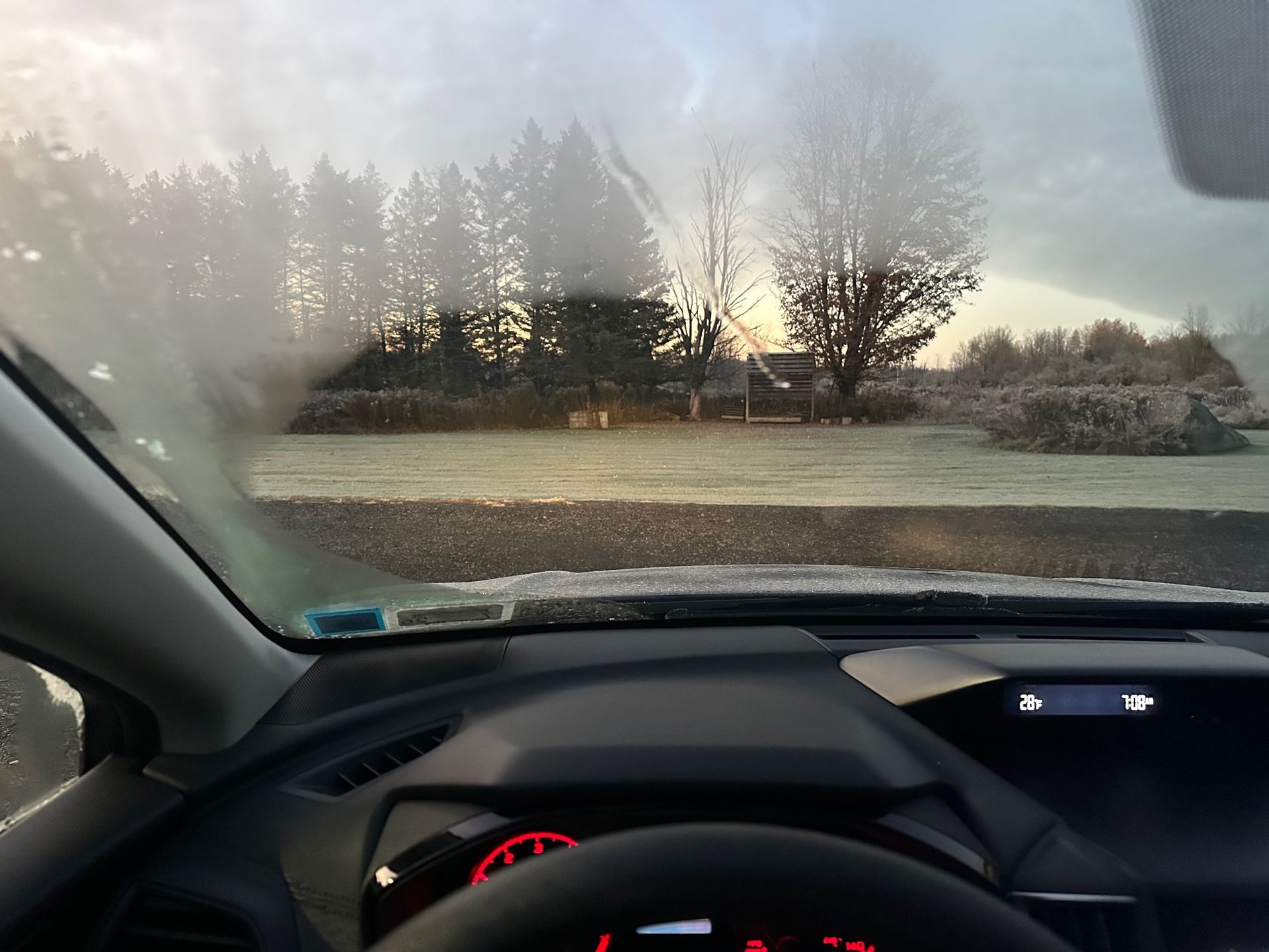 A car windshield with a lot of fog on it | Lou's Car Care Center, Inc.