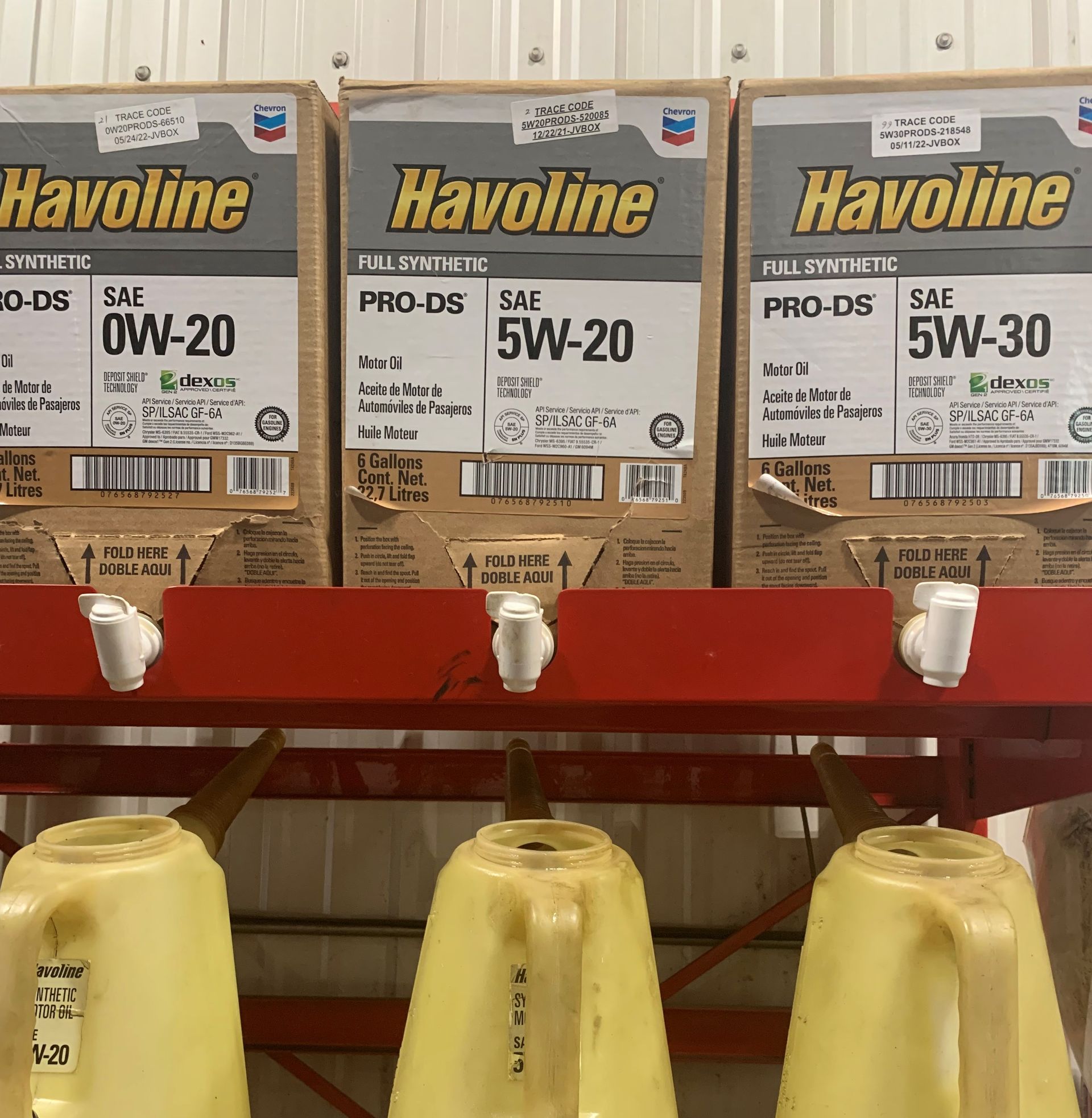 Boxes of havoline are lined up on a rack | Lou's Car Care Center, Inc.