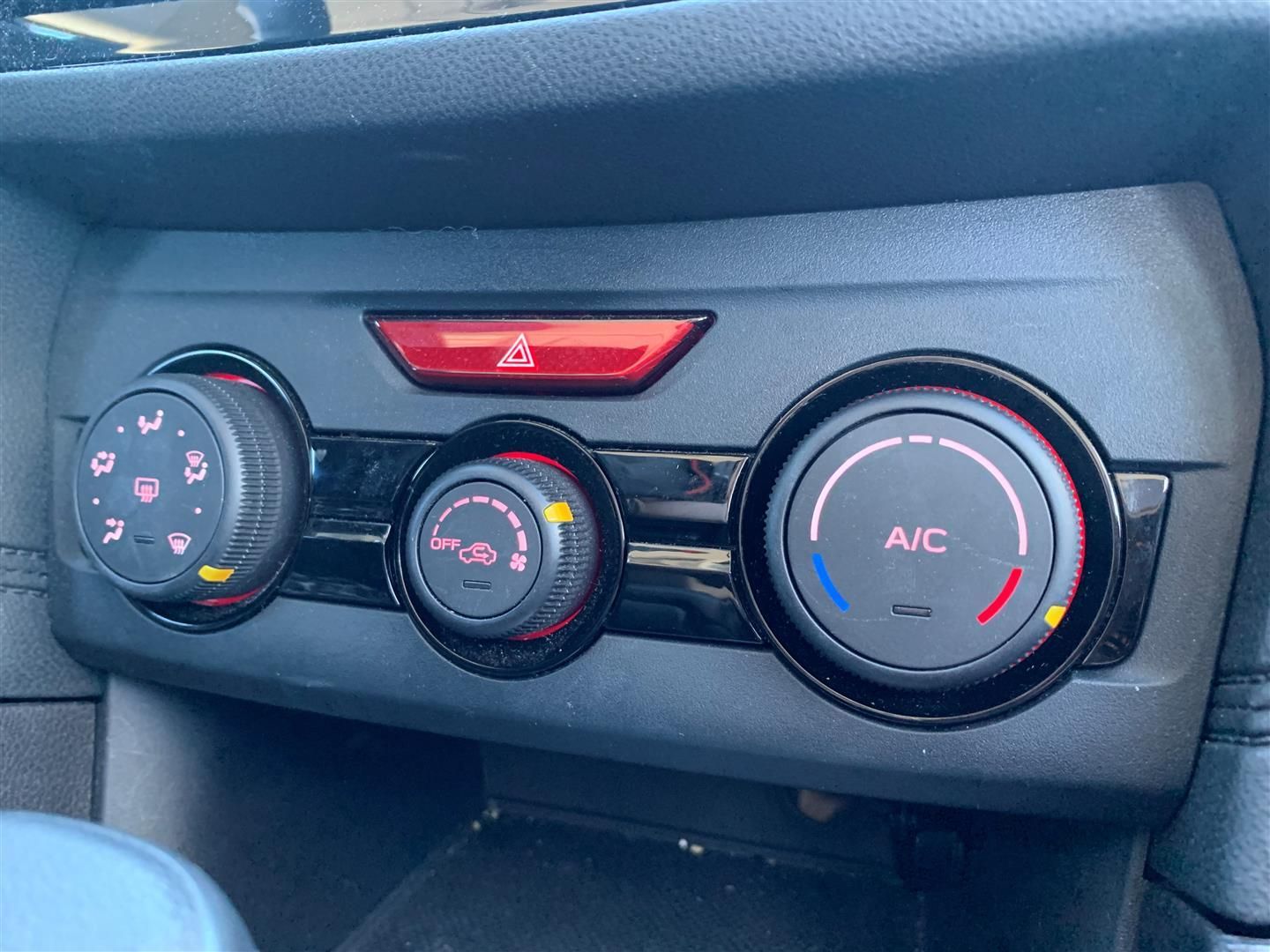 A close up of a car 's a/c control panel. | Lou's Car Care Center Inc.