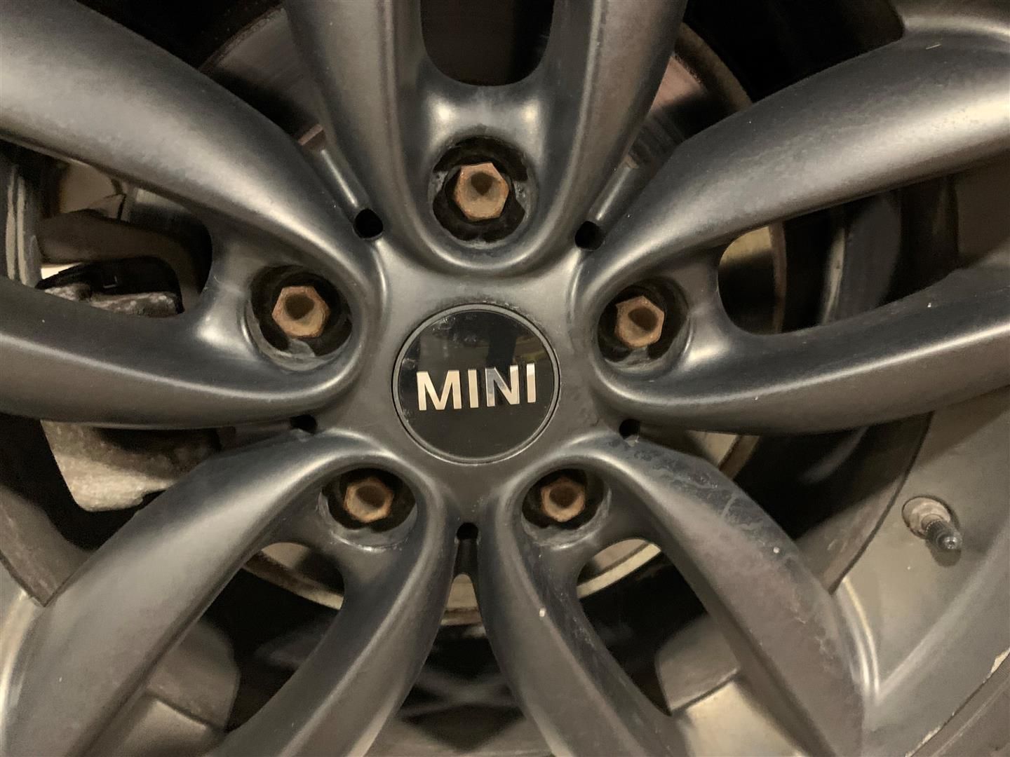 A close up of a wheel with the word mini on it | Lou's Car Care Center, Inc.