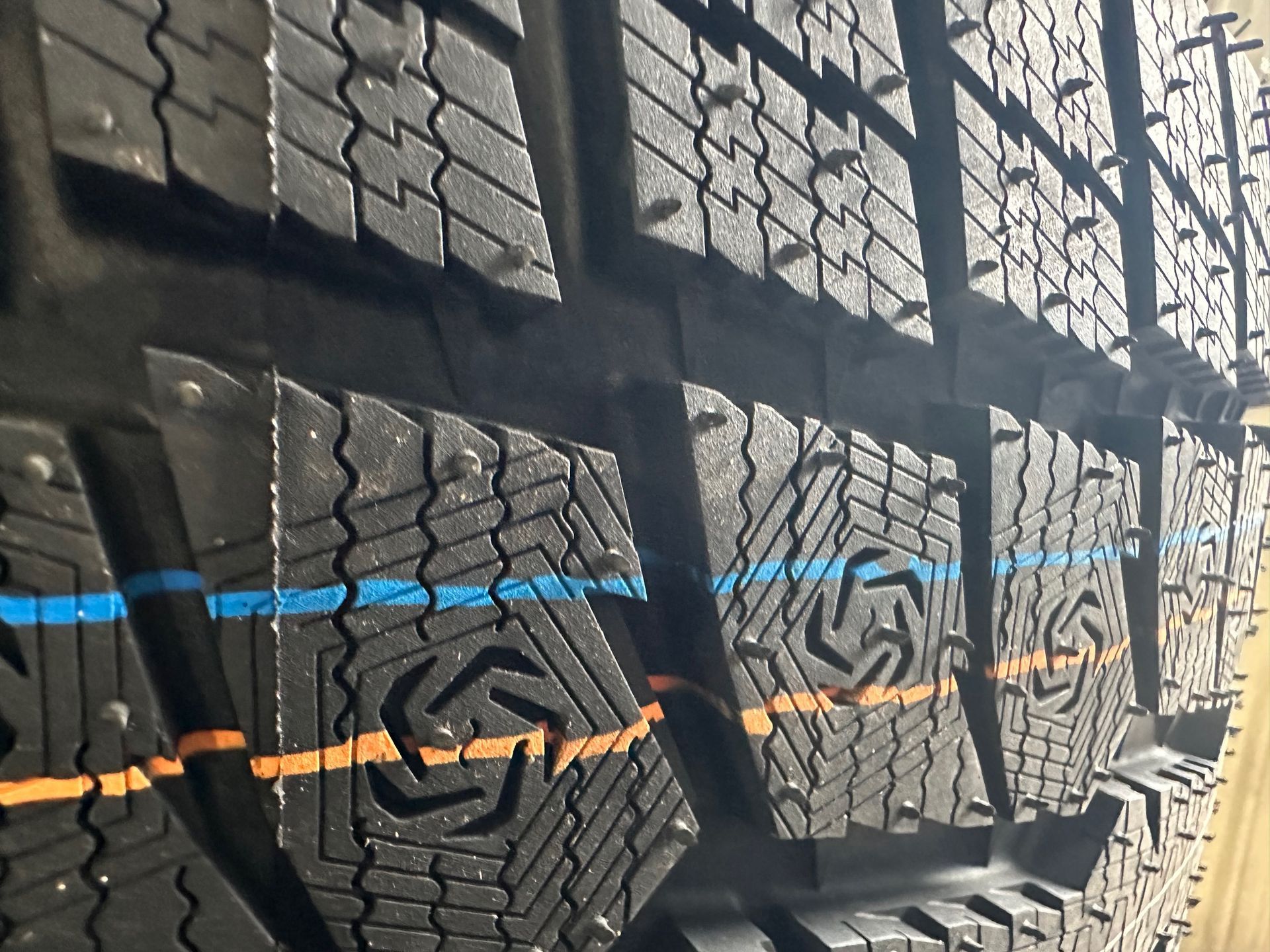 A close up of a row of tires with the letter g on them | Lou's Car Care Center, Inc.