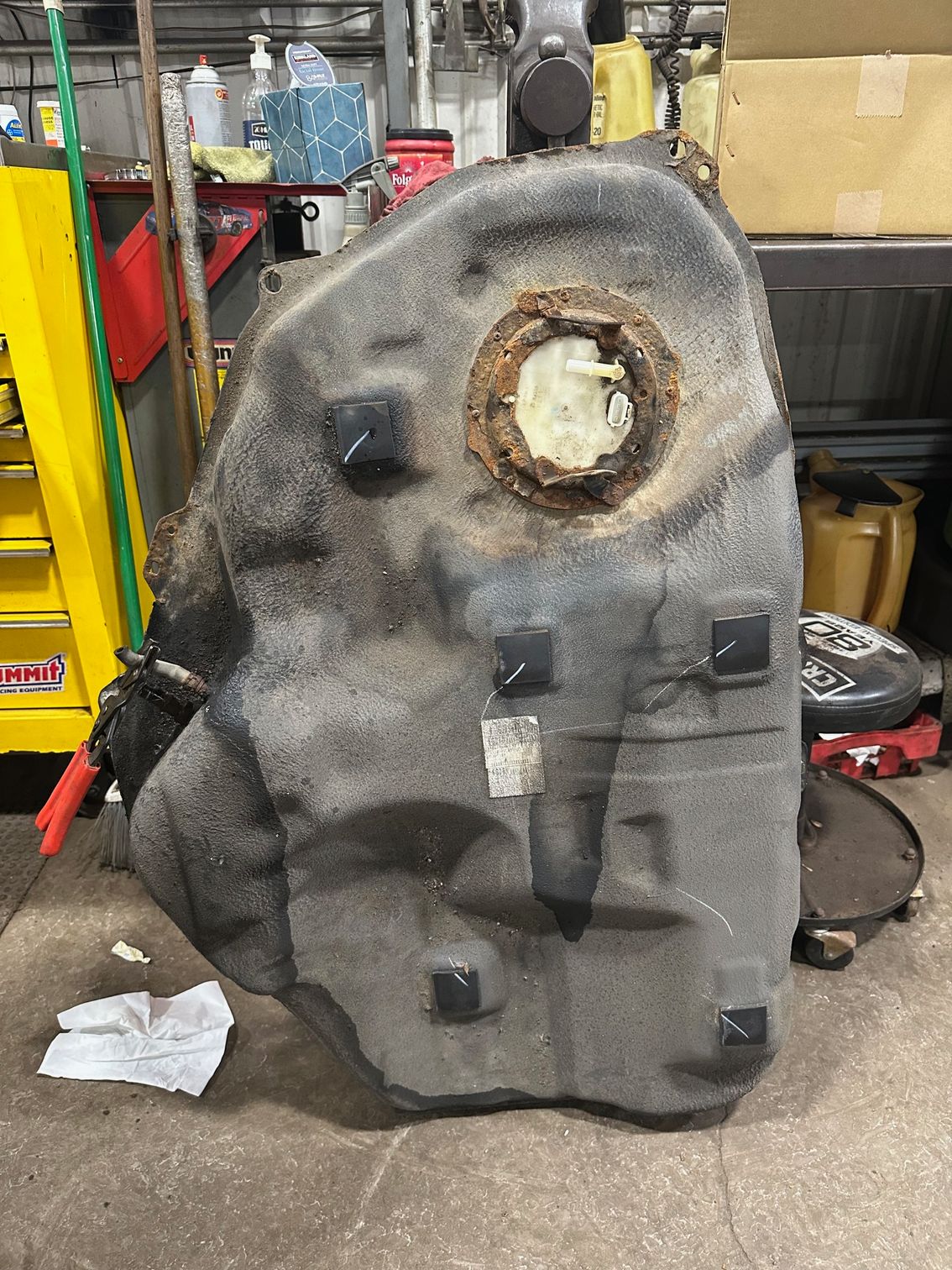 Old, rusted fuel pump in black gas tank | Lou's Car Care Center, Inc.