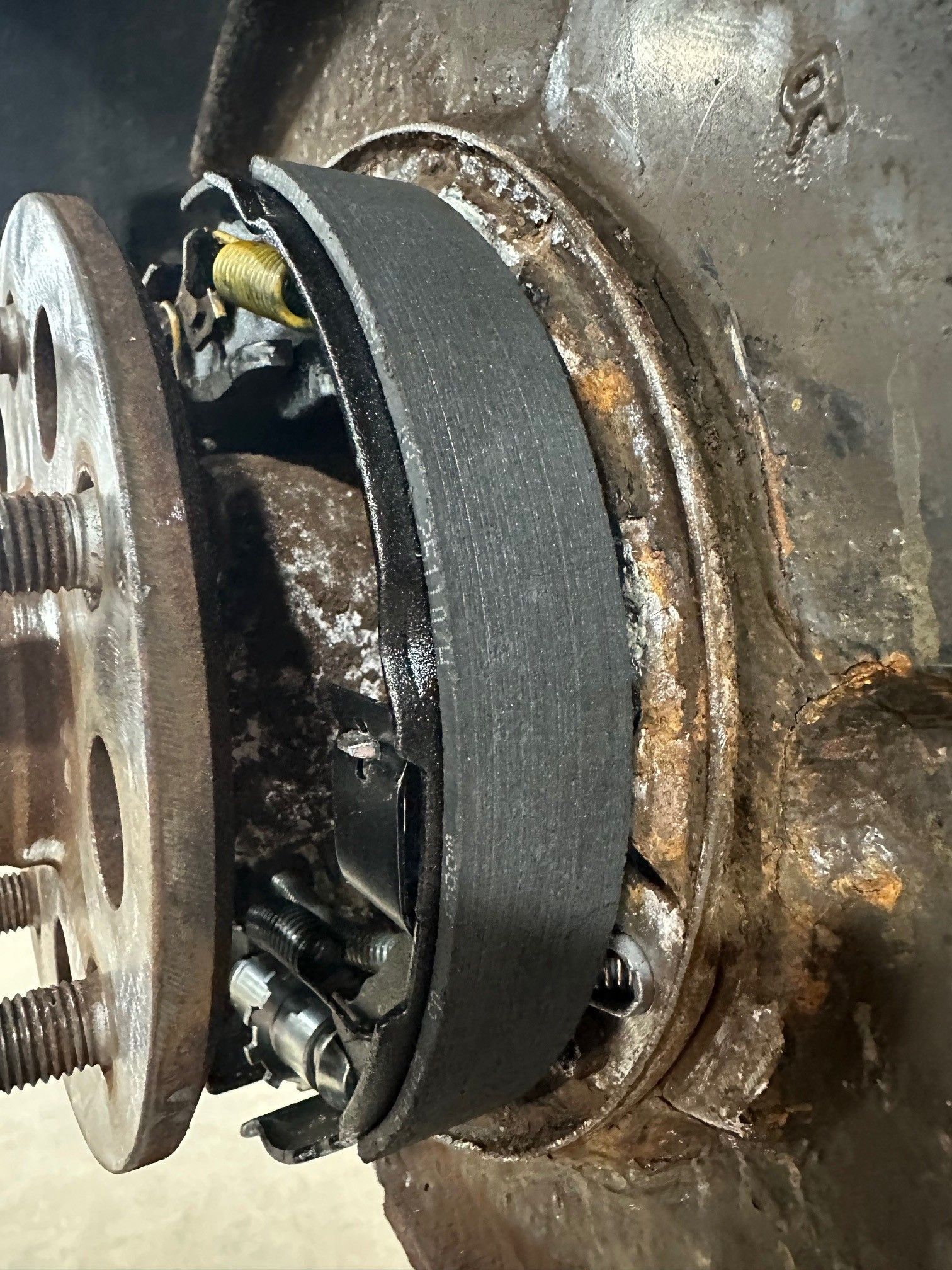 Close up of rusty parking brake show on vehicle in the shop | Lou's Car Care Center, Inc.