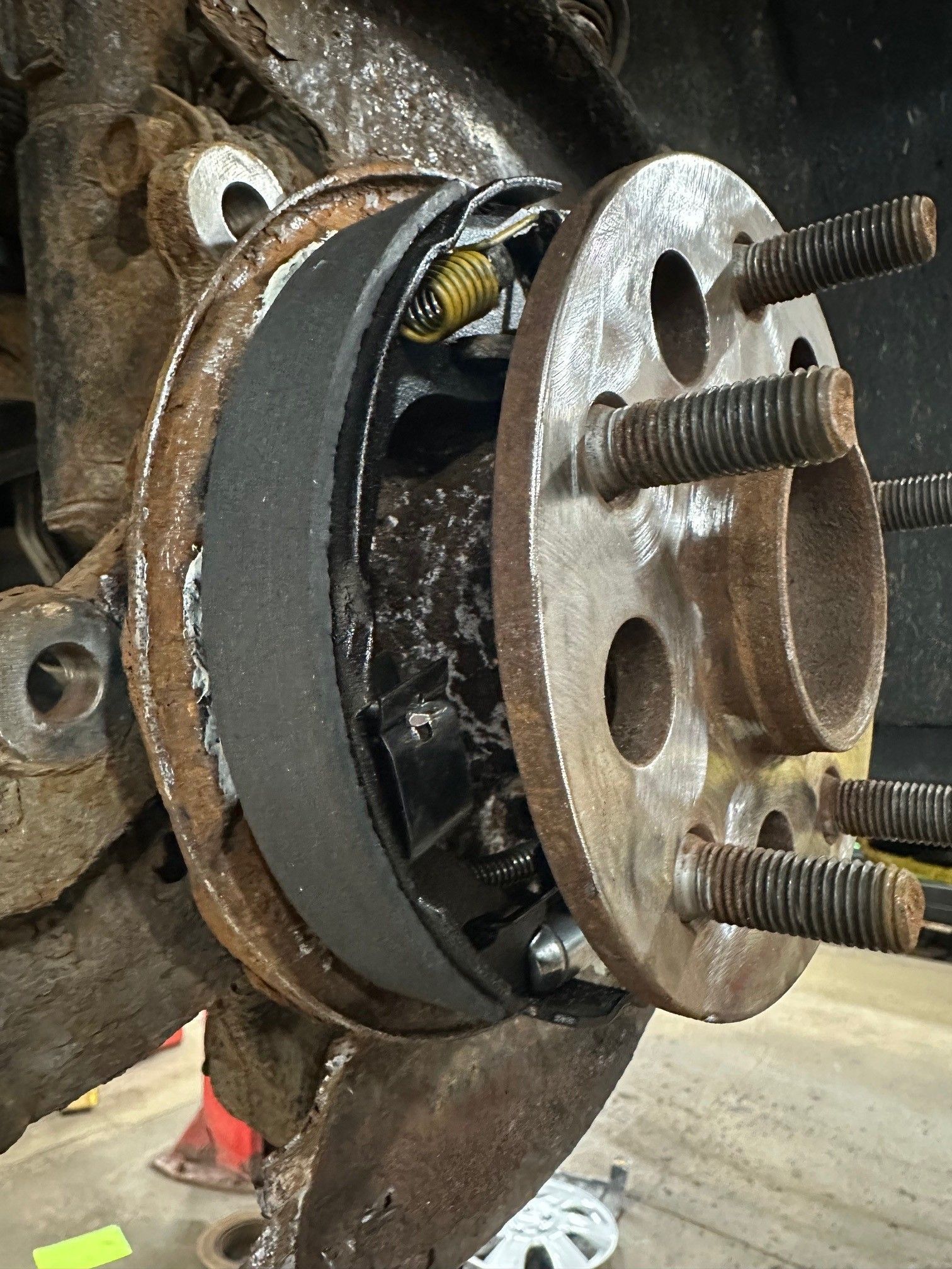 Old parking brake shoes on a vehicle in the shop | Lou's Car Care Center, Inc.