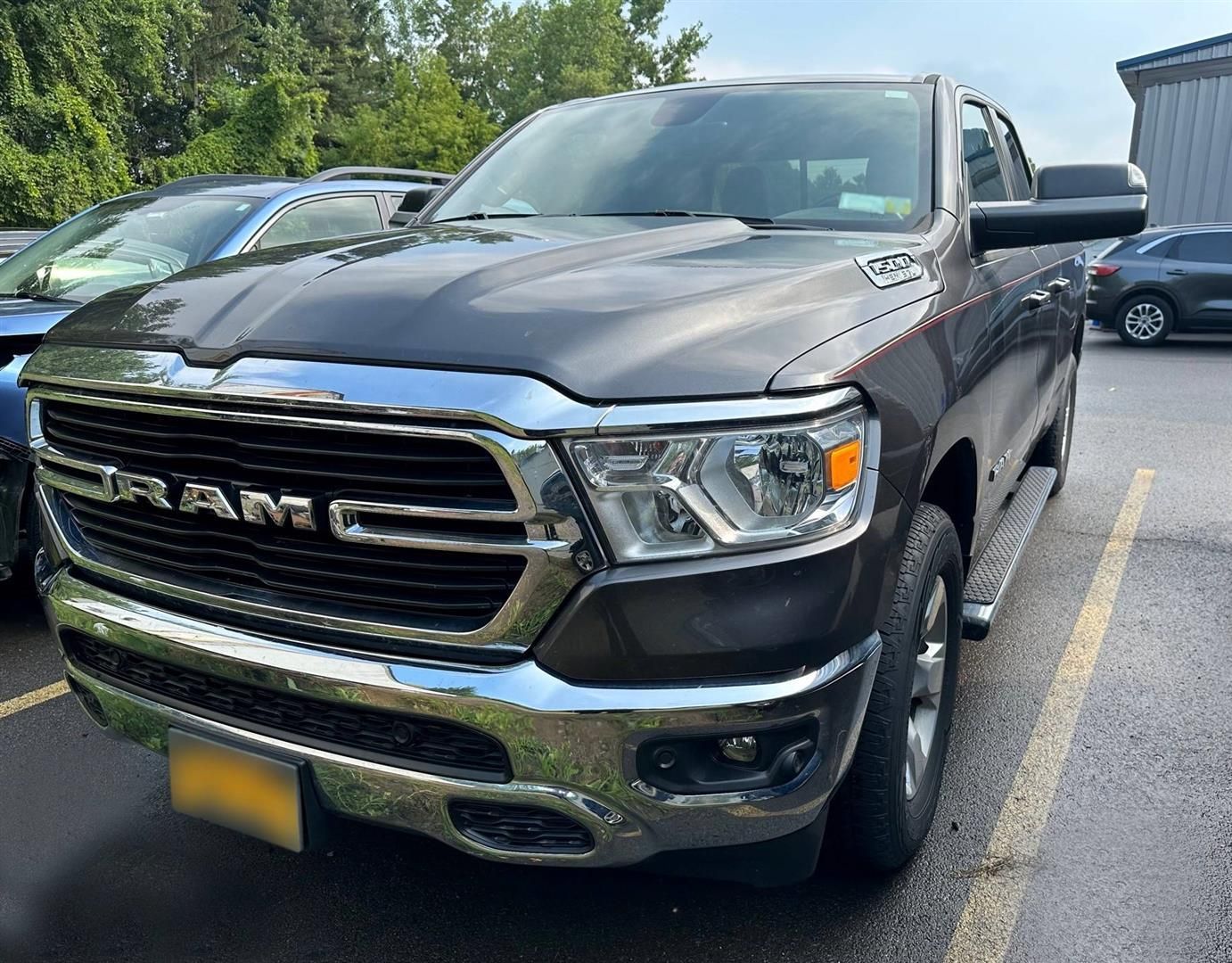 A ram truck is parked in a parking lot. | Lou's Car Care Center, Inc.