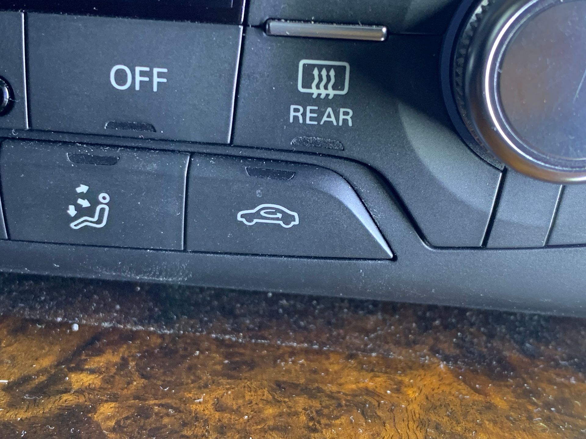 A close up of a car climate control that says off and rear | Lou's Car Care  Center Inc.