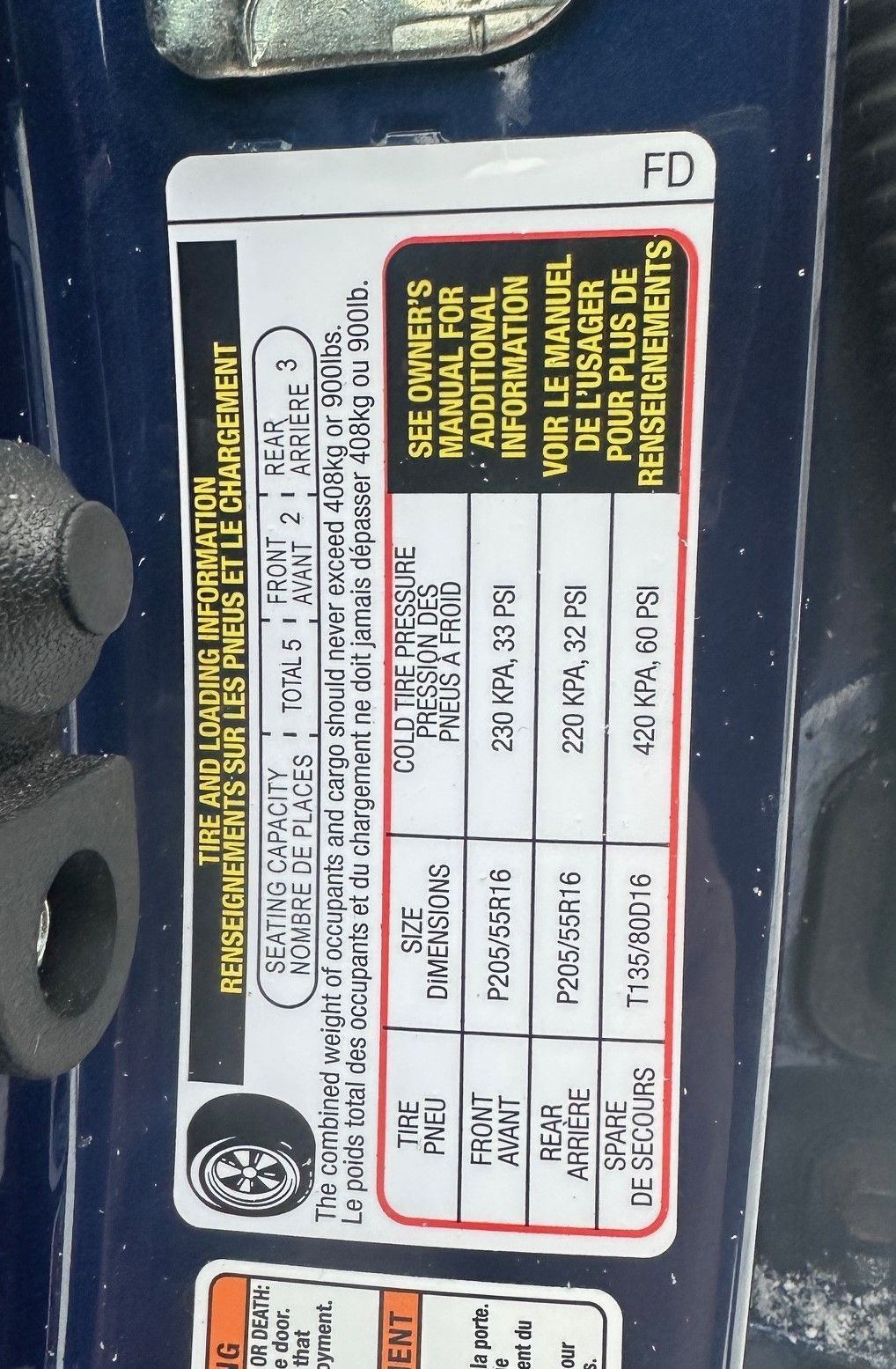 A sticker on the side of a car says see owners manual for additional information | Lou's Car Care Center