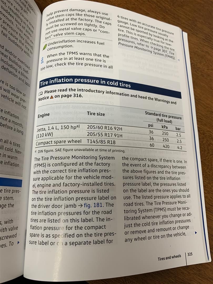 A book is open to a page that says ventilation pressure in cold   | Lou's Car Care Center, Inc.