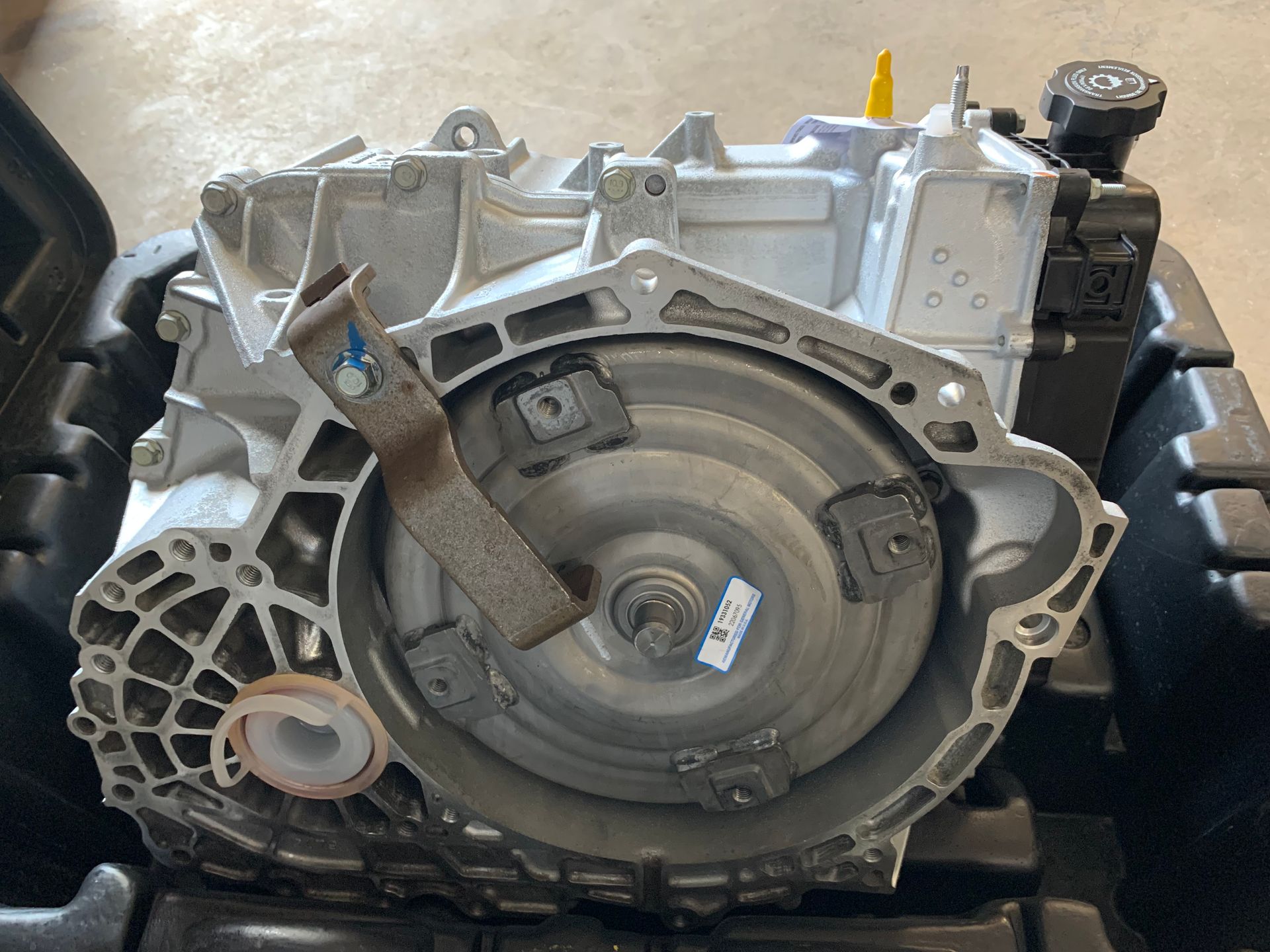 A close up of a car engine in a box. | Lou's Car Care Center, Inc.