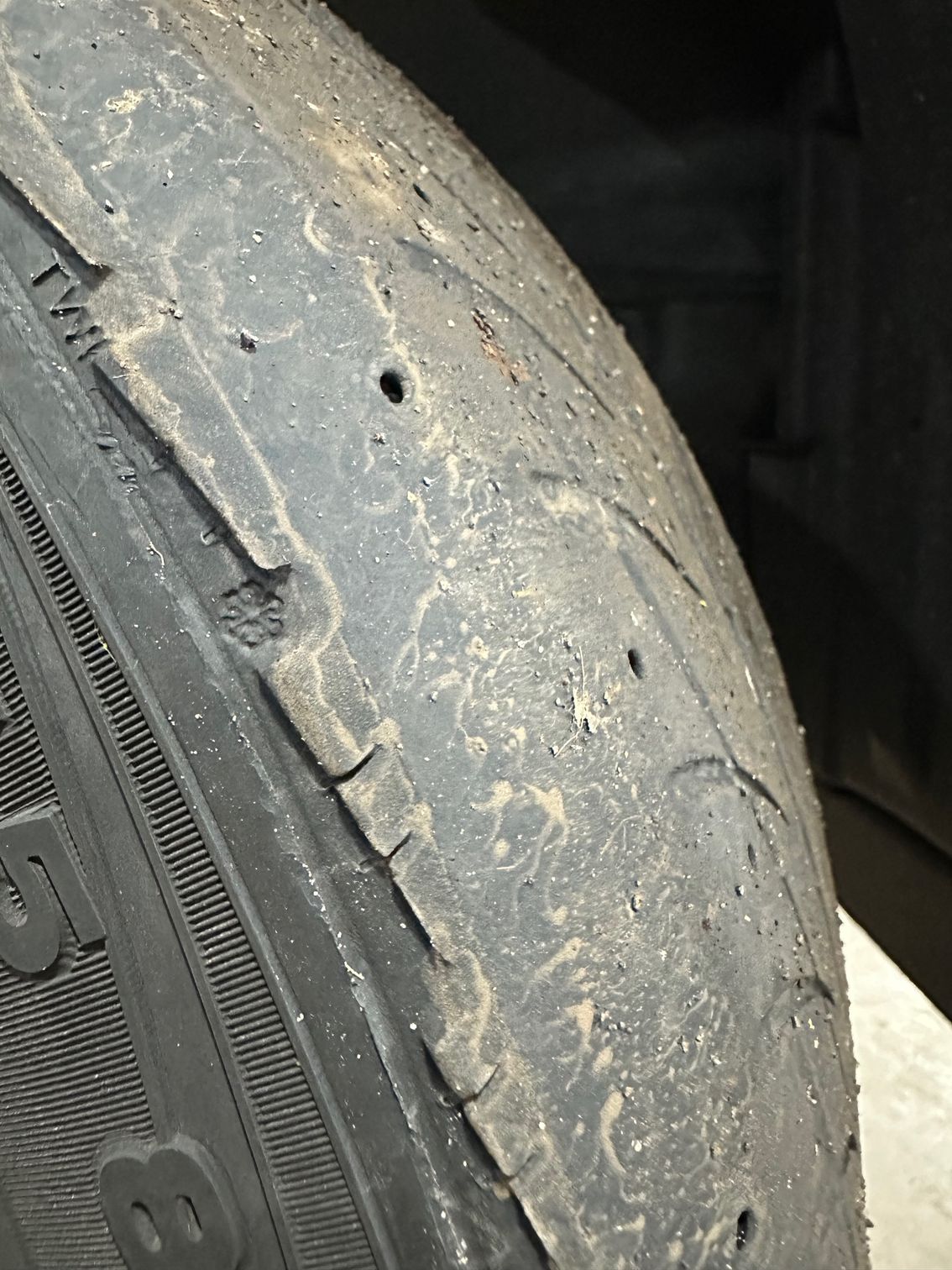 Severely worn tire tread on a vehicle tire | Lou's Car Care Center, Inc.