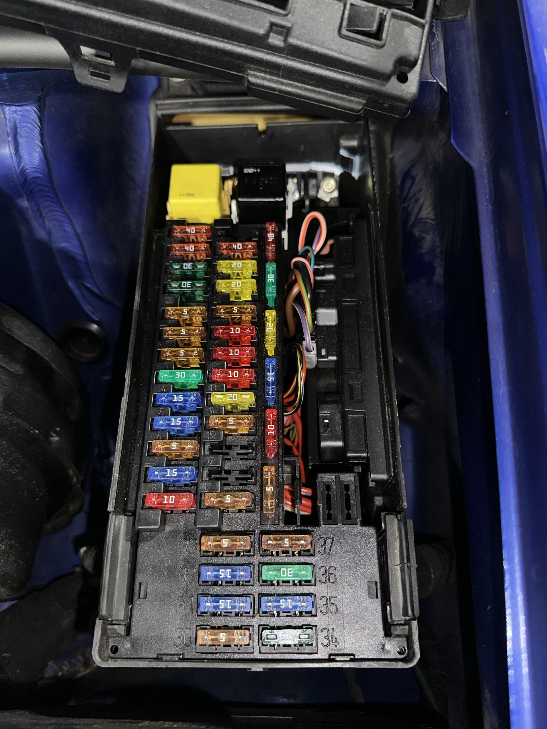 Fuse box in a blue vehicle | Lou's Car Care Center, Inc.