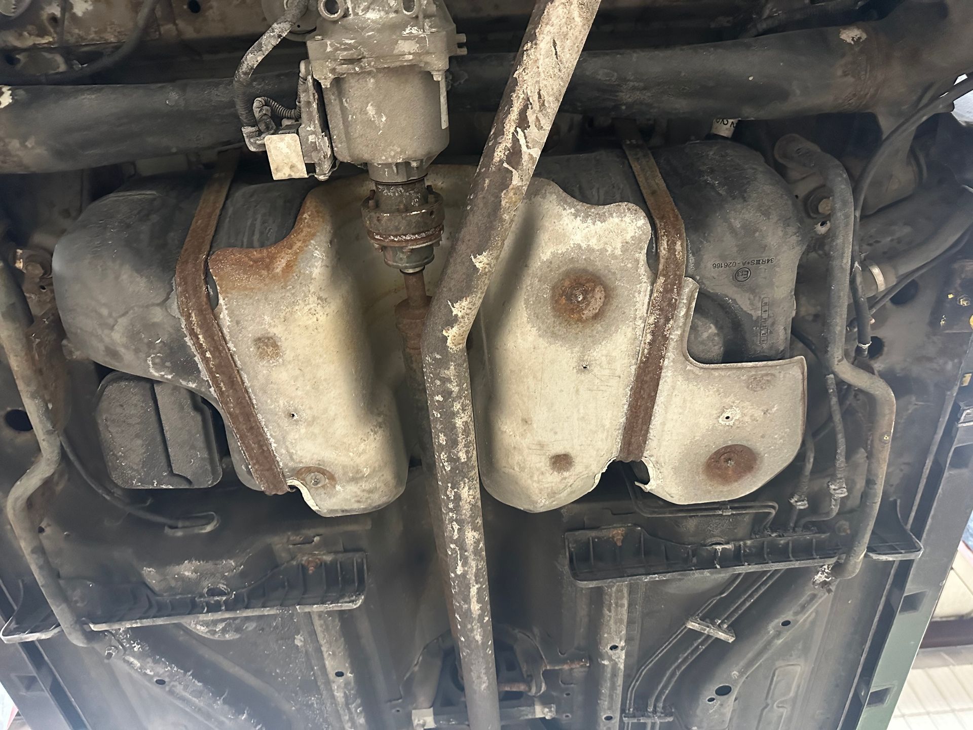 Black gas tank in vehicle in the shop | Lou's Car Care Center,Inc.