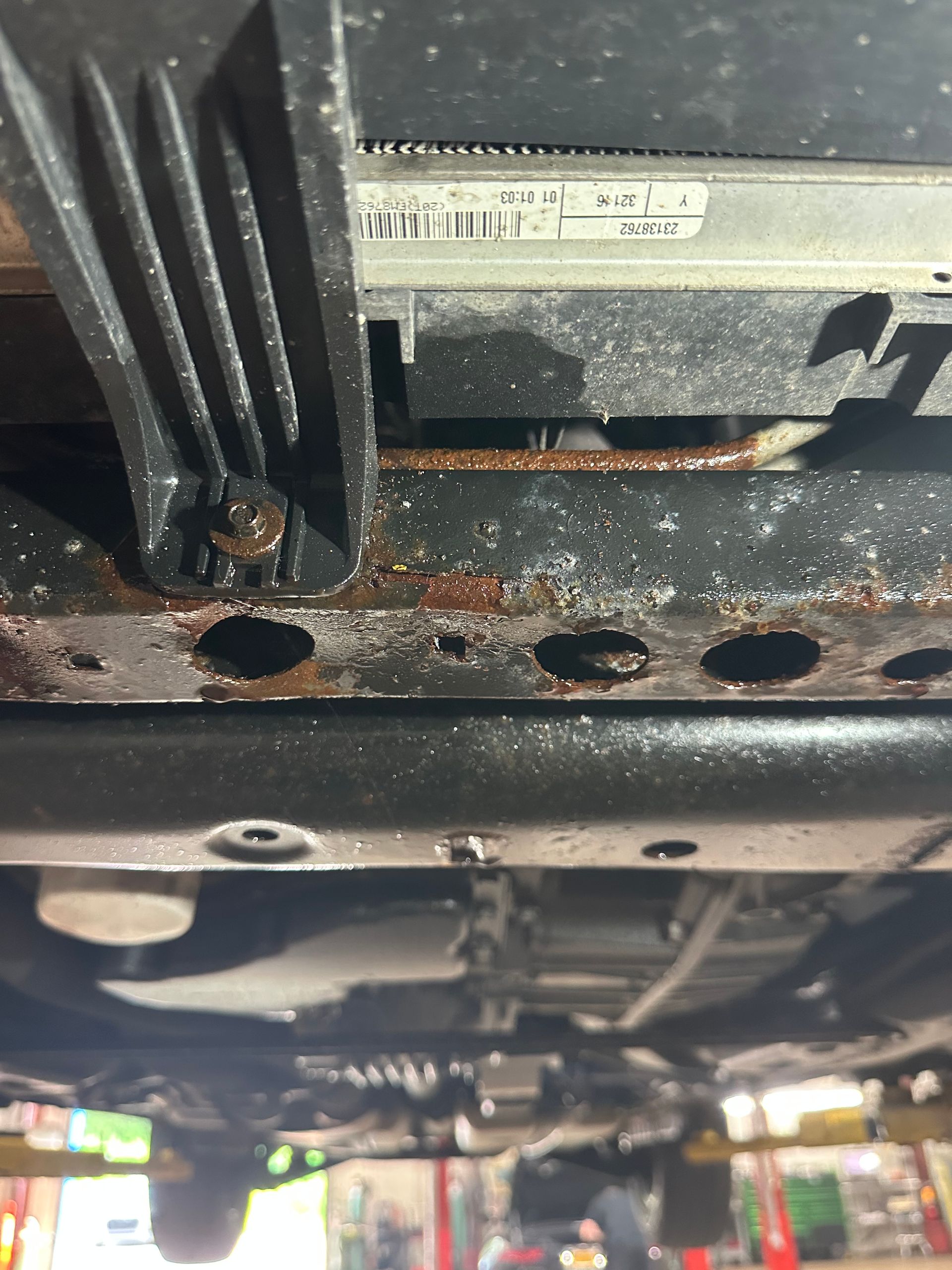 Transmission leak underneath vehicle.