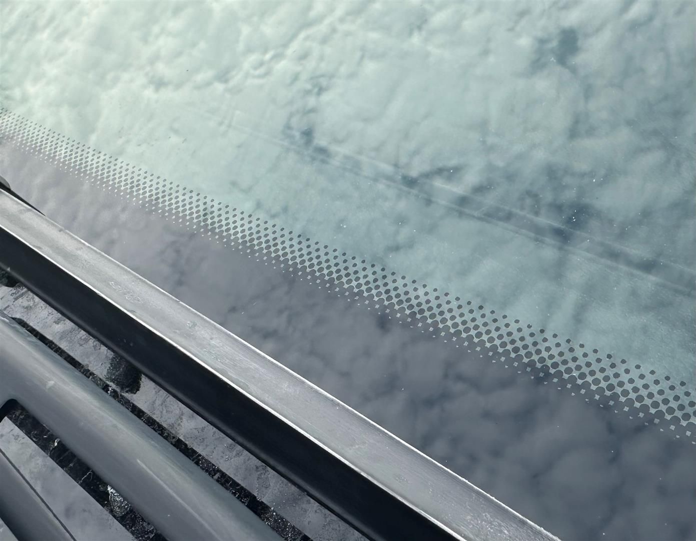 A close up of a car windshield with snow on it | Lou's Car Care Center, Inc.