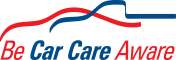 A logo for be car care aware with a red , white and blue ribbon. | Lou's Car Care Center