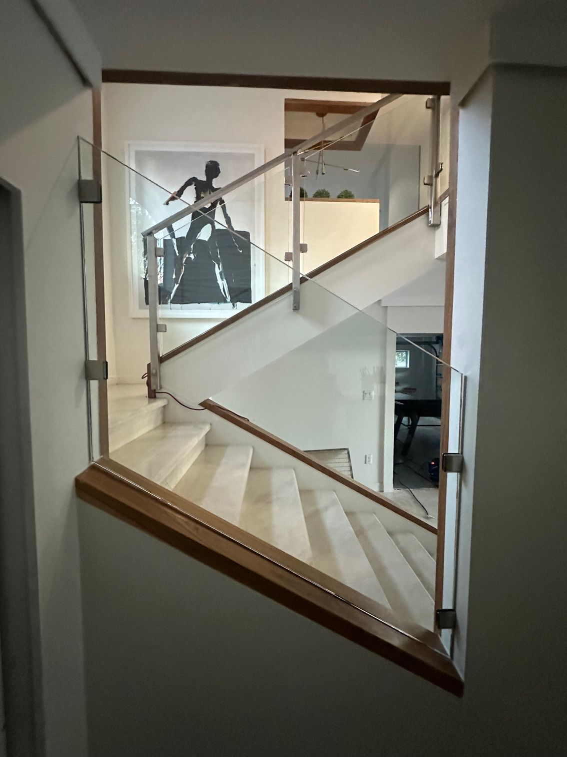 Staircase with glass and wood railing