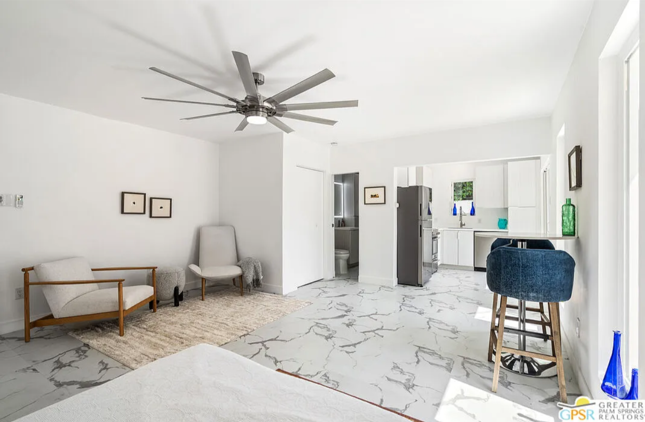 Bright white living space with kitchen