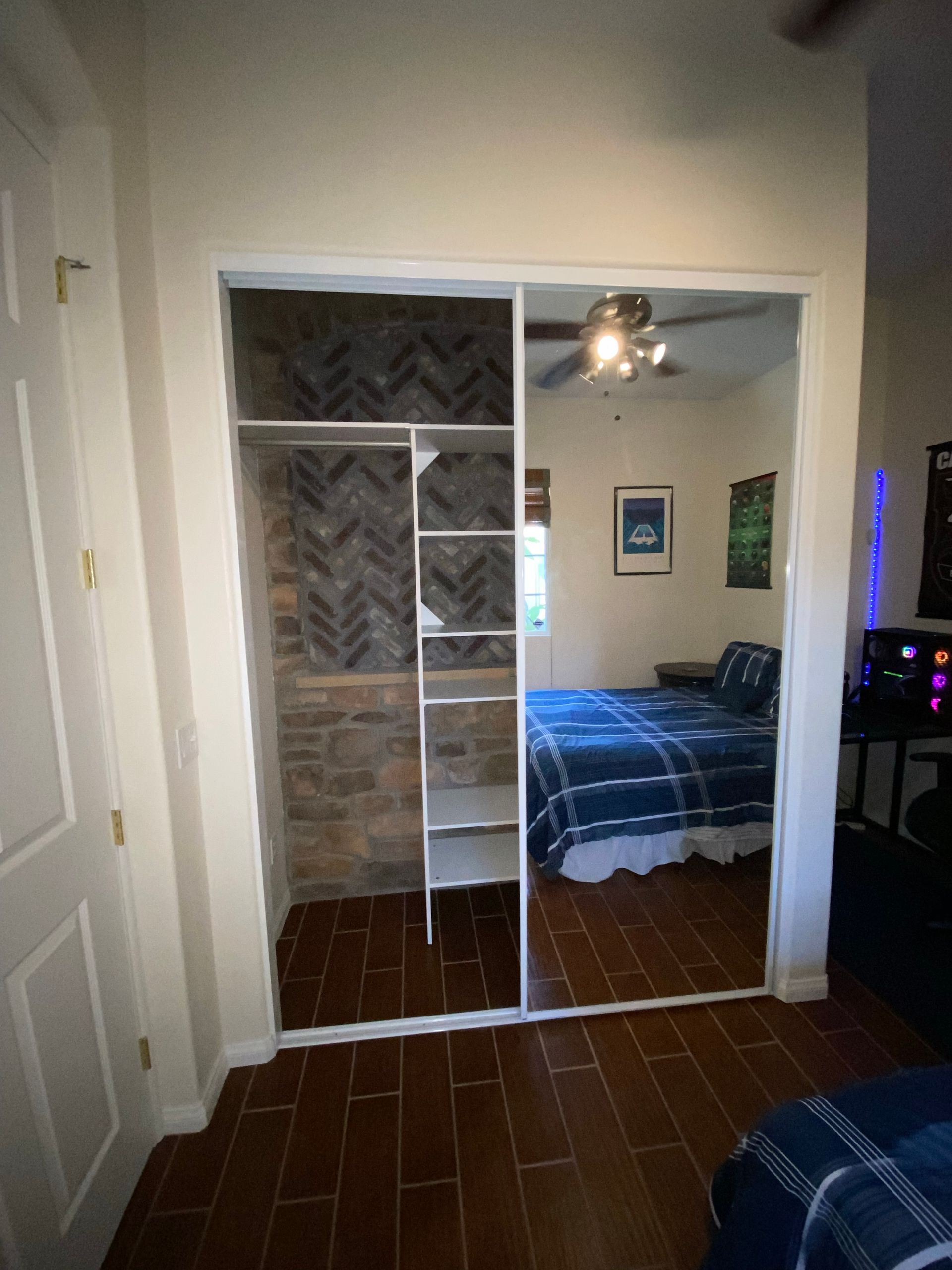 Bedroom closet with mirrored sliding doors