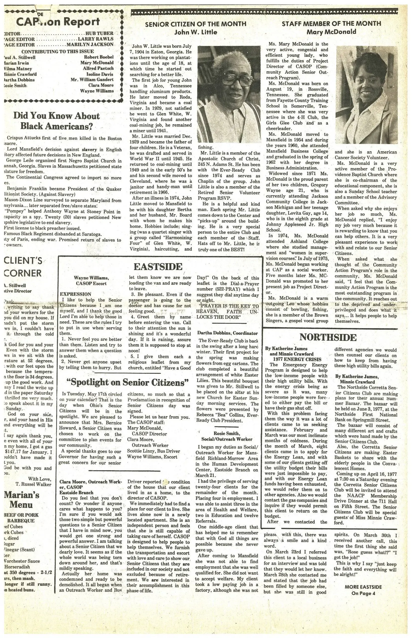 A page of a newspaper with a picture of two people on it.