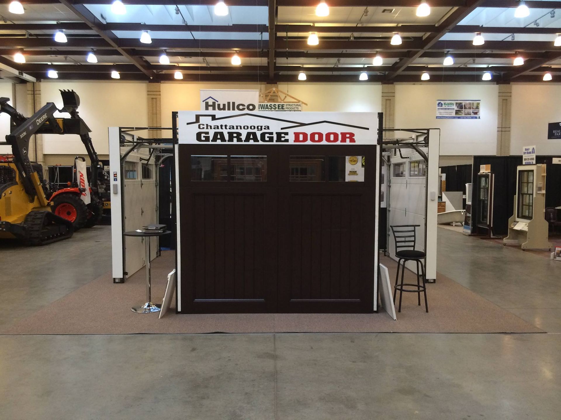 A garage door is displayed in a large room
