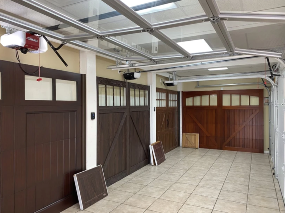 A garage with a lot of garage doors and a ceiling fan.