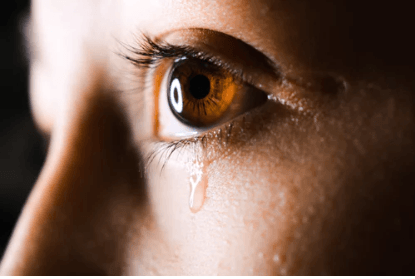 woman's eye with tear coming from it to represent what is OCD meaning