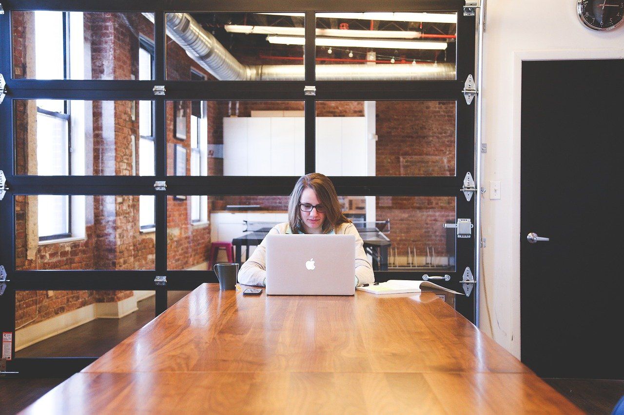 woman working in office on laptop high achievers struggle with forgiveness