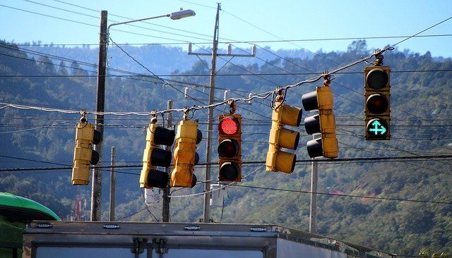 many traffic lights with different signs are causing mess about how to get things done with anxiety