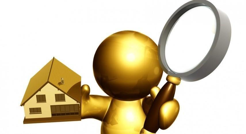 A gold figure is holding a magnifying glass in front of a house.