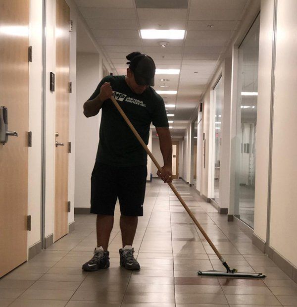 Professional Worker Moping the Floor