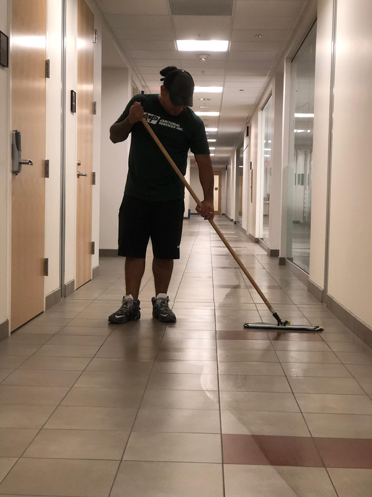 Worker Cleaning the Floor