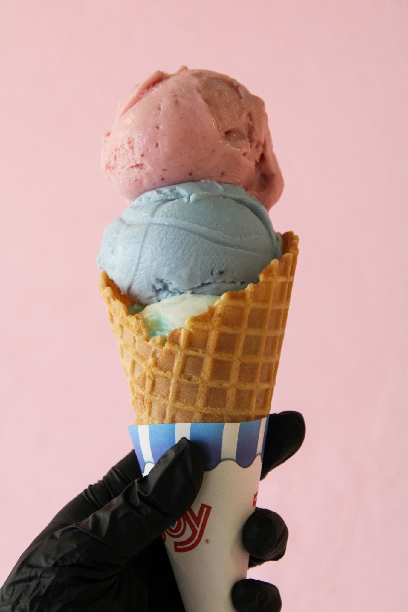 Ice cream cone with two scoops.