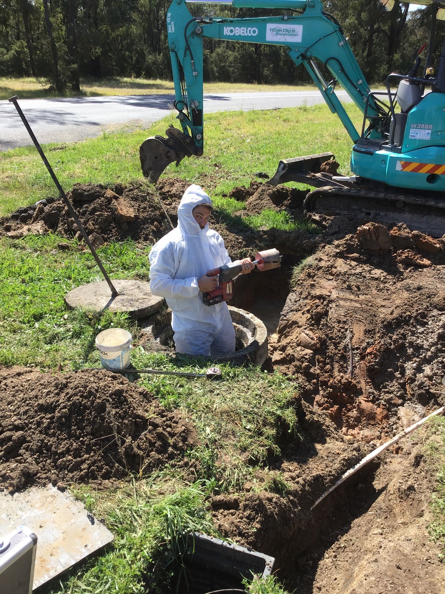 man in muddy hole