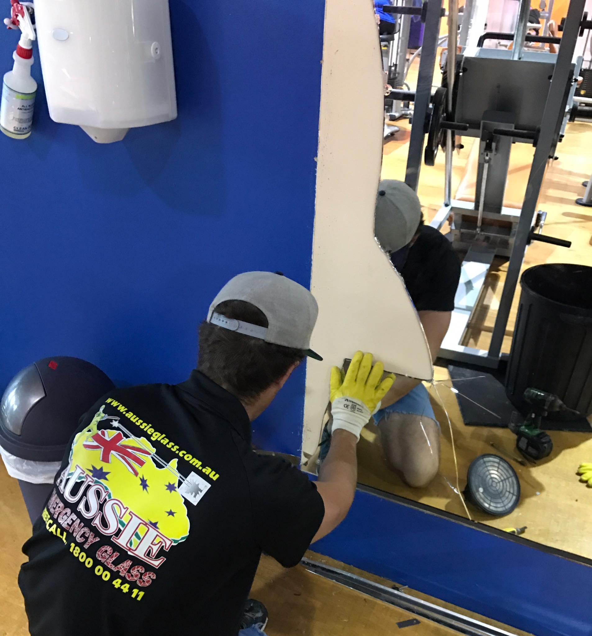 Shattered mirror glass showcasing the need for professional glass replacement and repair.