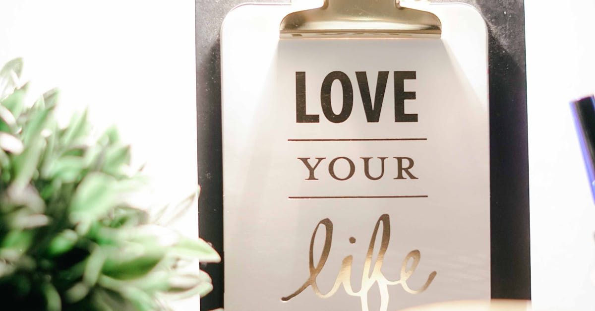 A clipboard with the words `` love your life '' written on it.