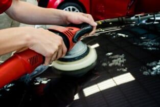 Hands with daul action polisher - Auto Body Services in Talleyville DE